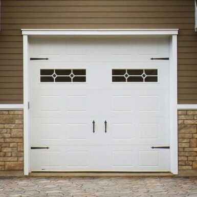 Practical Guide : Everything You Need to Know About Buying THE Garage Door • Garex White sectional garage door with steel panels, classic design for residential use.