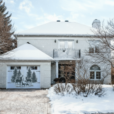 Garage door decorated with a deer, pine trees, snow for a magical winter wonderland decor